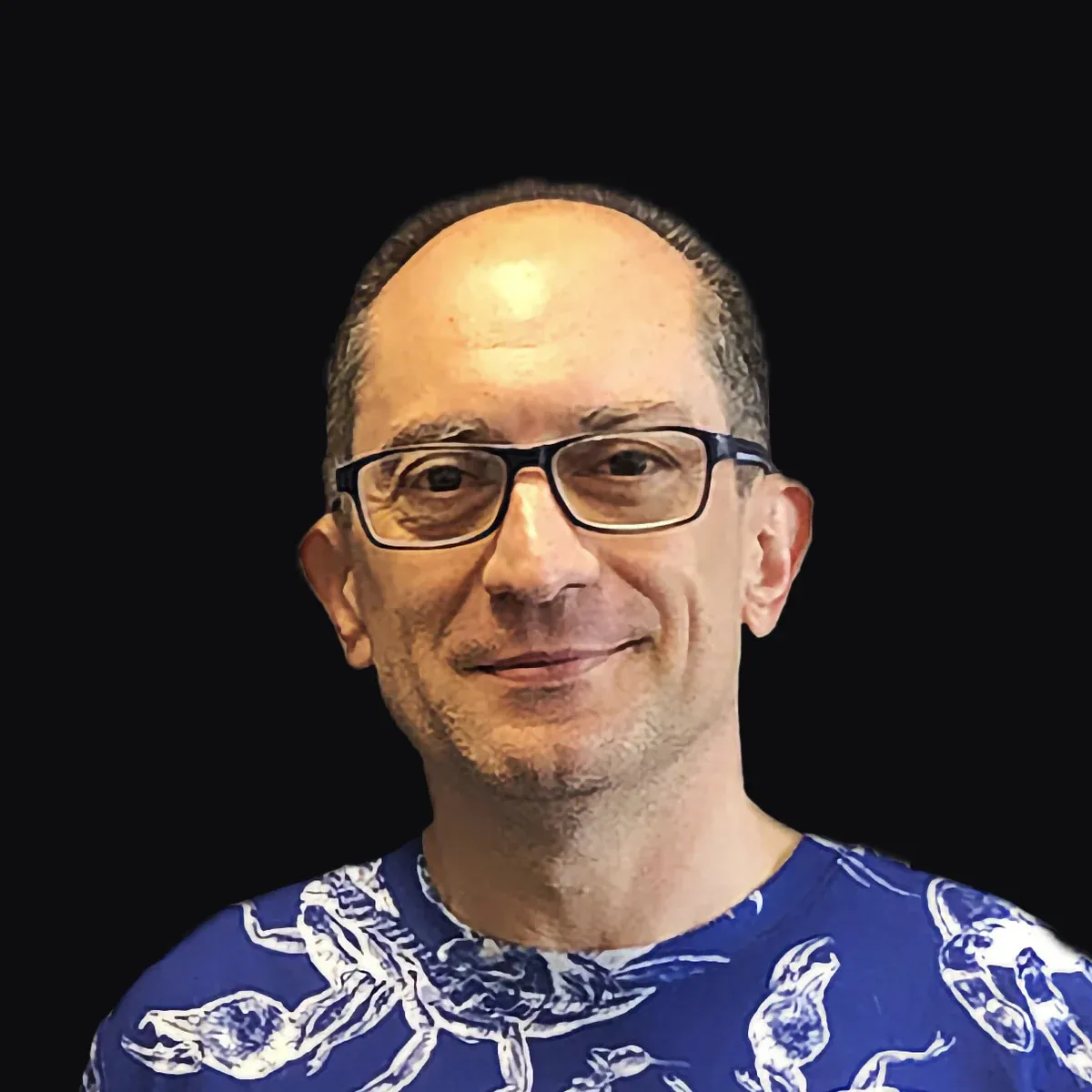 Lluís Miquel García-Raffi, in a blue T-shirt with a white print, smiling.