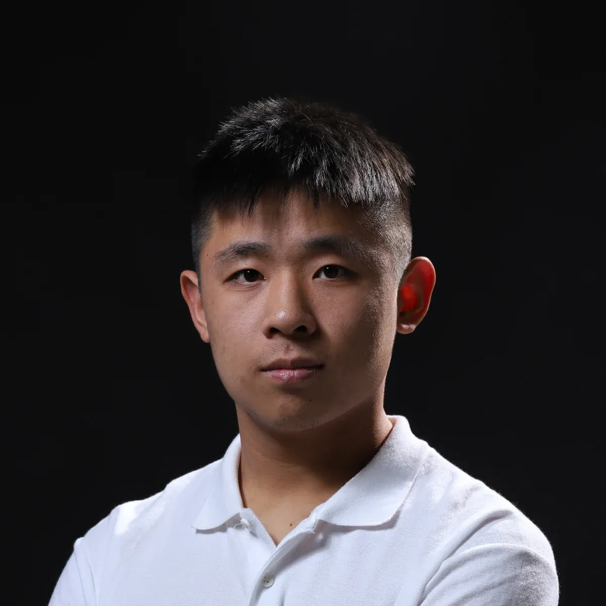 Yuxiao Lin, in a white polo.